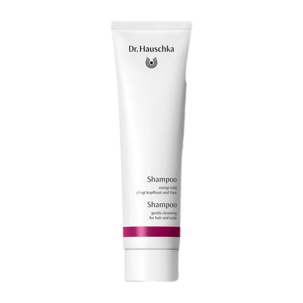 Weiße Tube mit Produktnamen und Logo. Text: Shampoo, reinigt mild, pflegt Kopfhaut und Haar.
