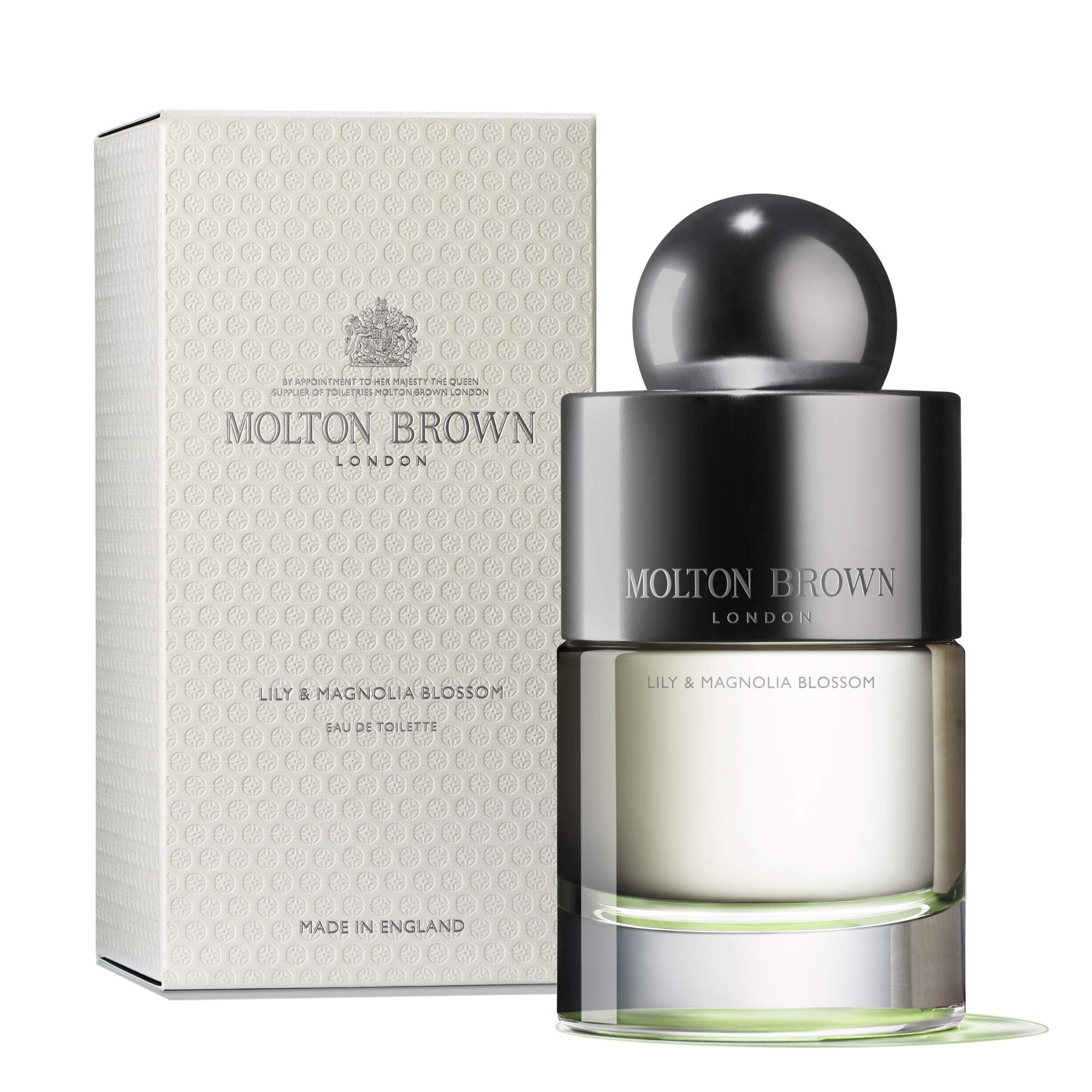 Molton Brown Lily & Magnolia Blossom Eau de Toilette und Verpackung. Flakon mit silberner Kappe, daneben die Schachtel.