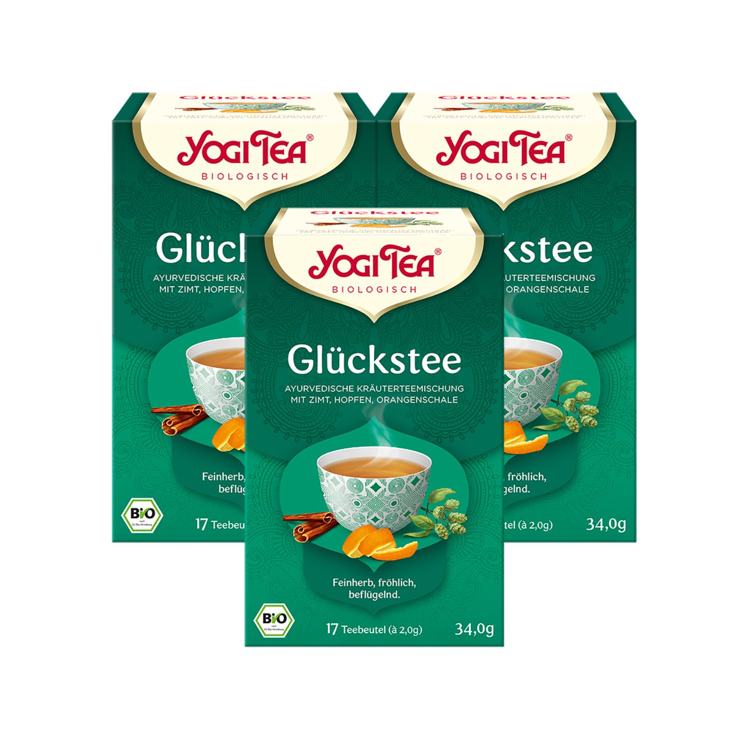 Drei Packungen Yogi Tea Glückstee. Grüne Verpackung mit Logo und Produktbezeichnung. Bio-Siegel. 17 Teebeutel.