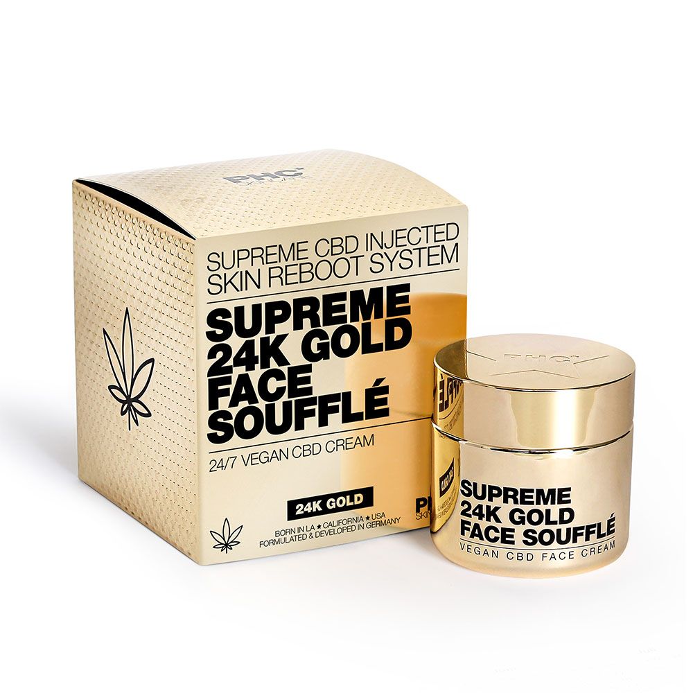 Goldfarbene Schachtel und Tiegel. Text: Supreme 24K Gold Face Soufflé. 24/7 Vegan CBD Cream. Cannabis-Blatt. Tiegel daneben.