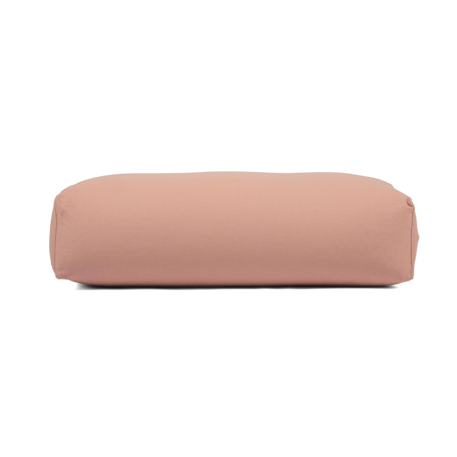 Rosa Yoga-Bolster aus Baumwolle mit Dinkel-Füllung. Rechteckige Form mit abgerundeten Enden.