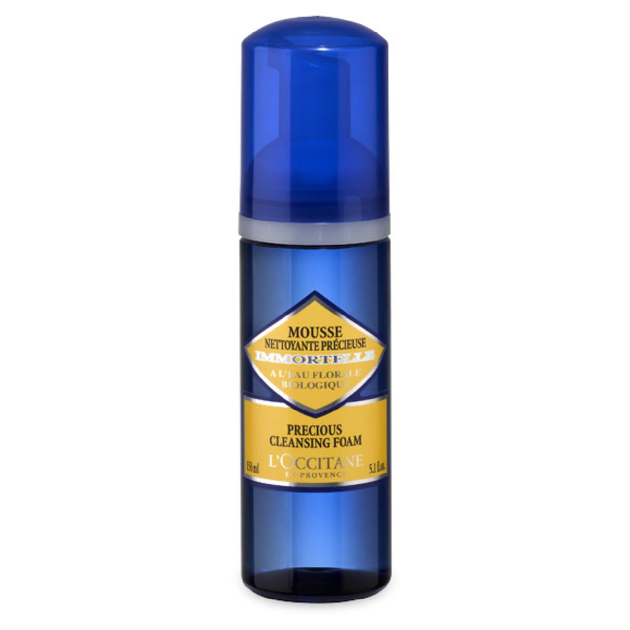 Blaue Flasche L'Occitane Reinigungsschaum. Aufschrift: Mousse Nettoyante Précieuse, 150 ml, Bio.