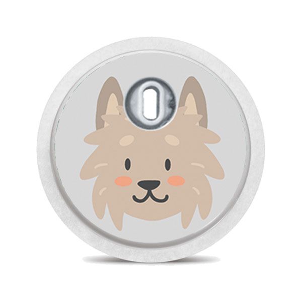 Runder Aufkleber mit einem Hundegesicht. Der Aufkleber hat ein Loch und einen Metallring.