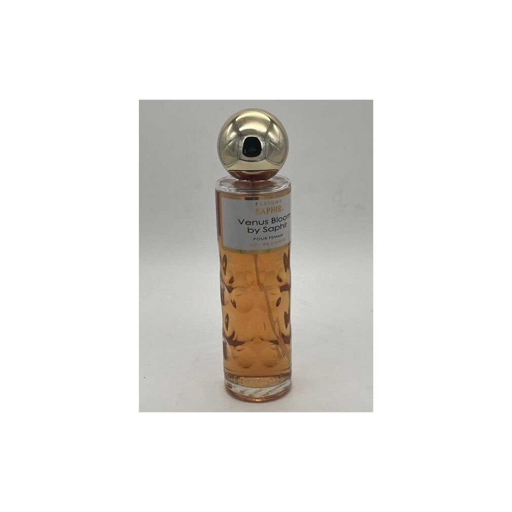 Glasflasche mit goldfarbenem Verschluss. Aufschrift: Venus Bloom by Saphir. Hellbraune Flüssigkeit sichtbar.