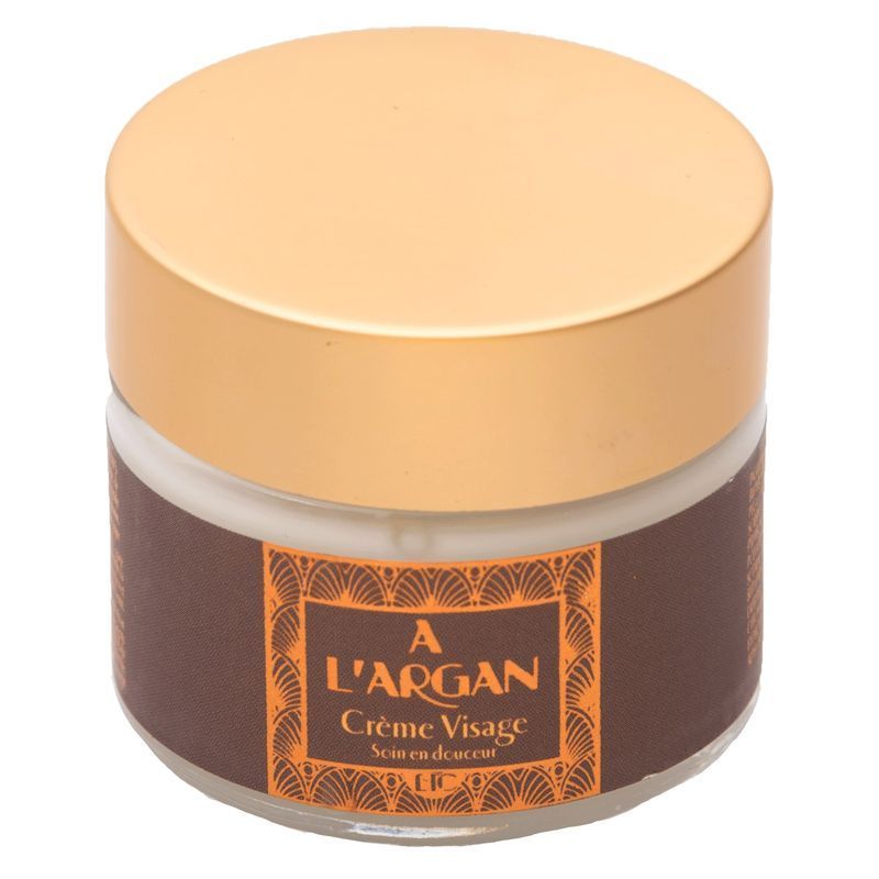 Pot rond avec couvercle doré. L'étiquette marron porte "A L'ARGAN Crème Visage".