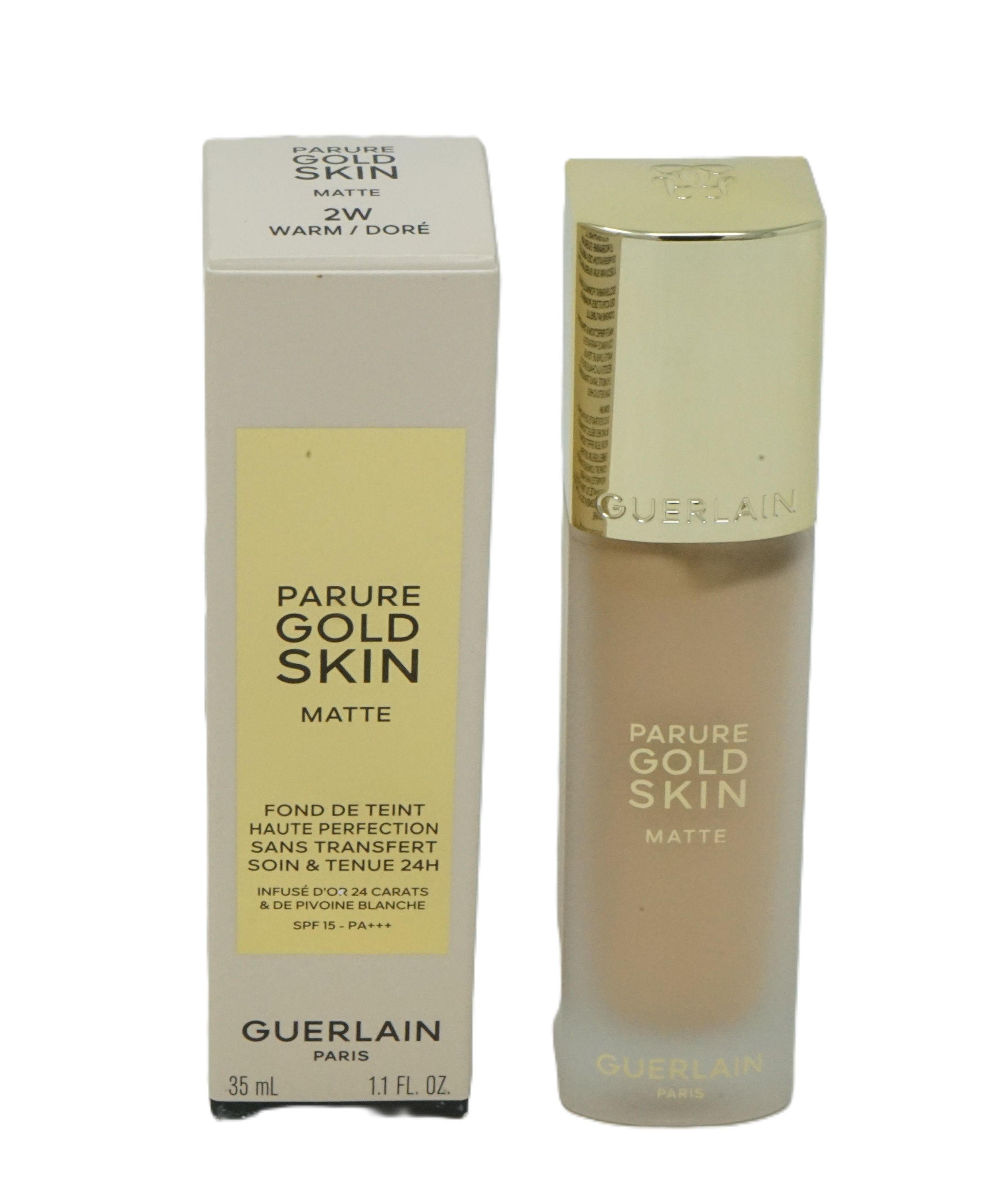 Beige Foundation-Fläschchen und Schachtel. Goldener Deckel, Schriftzug 'PARURE GOLD SKIN MATTE'. Auf der Schachtel: '2W WARM/DORÉ'.