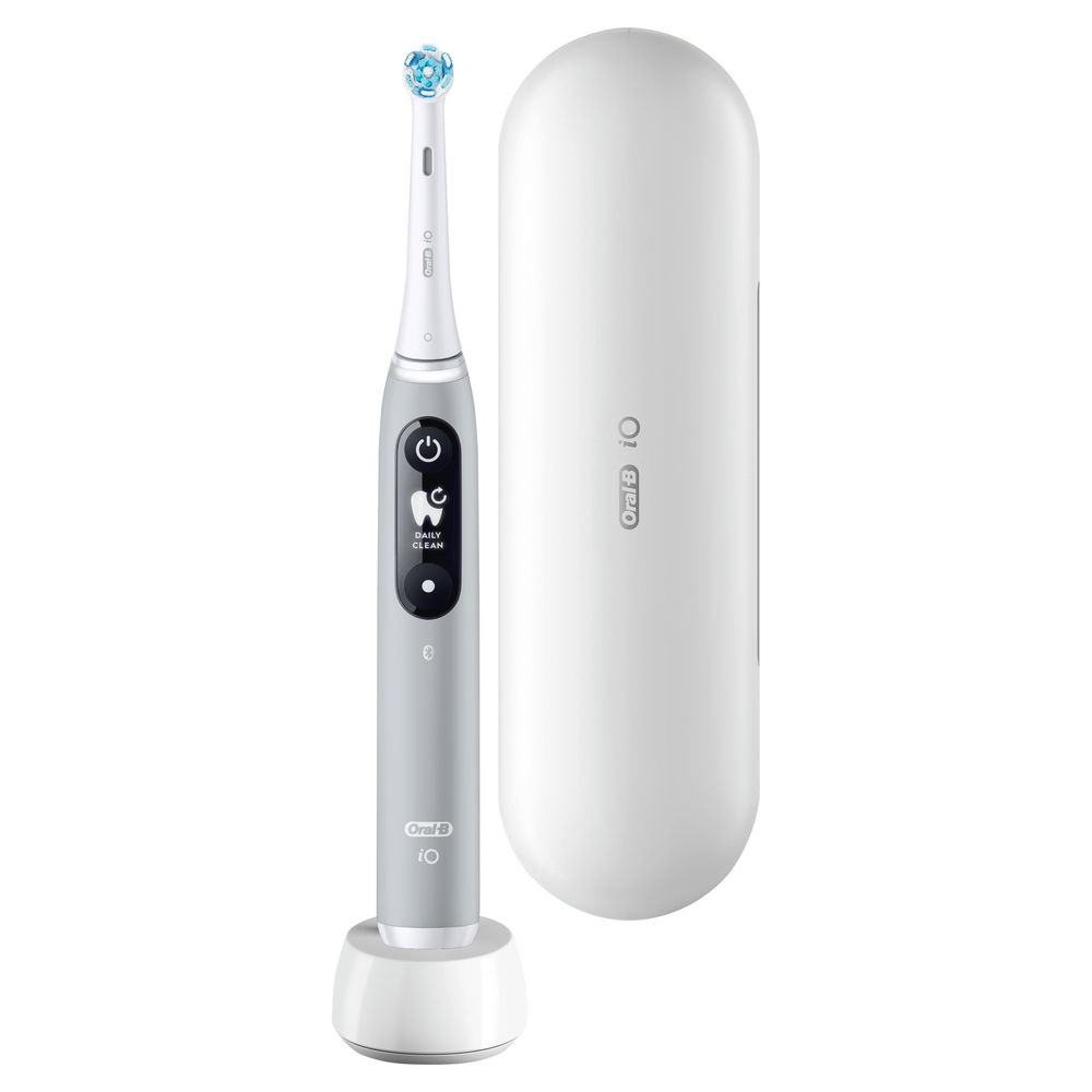 Graue elektrische Zahnbürste mit Ladestation und Reiseetui. Produkt im Detail.