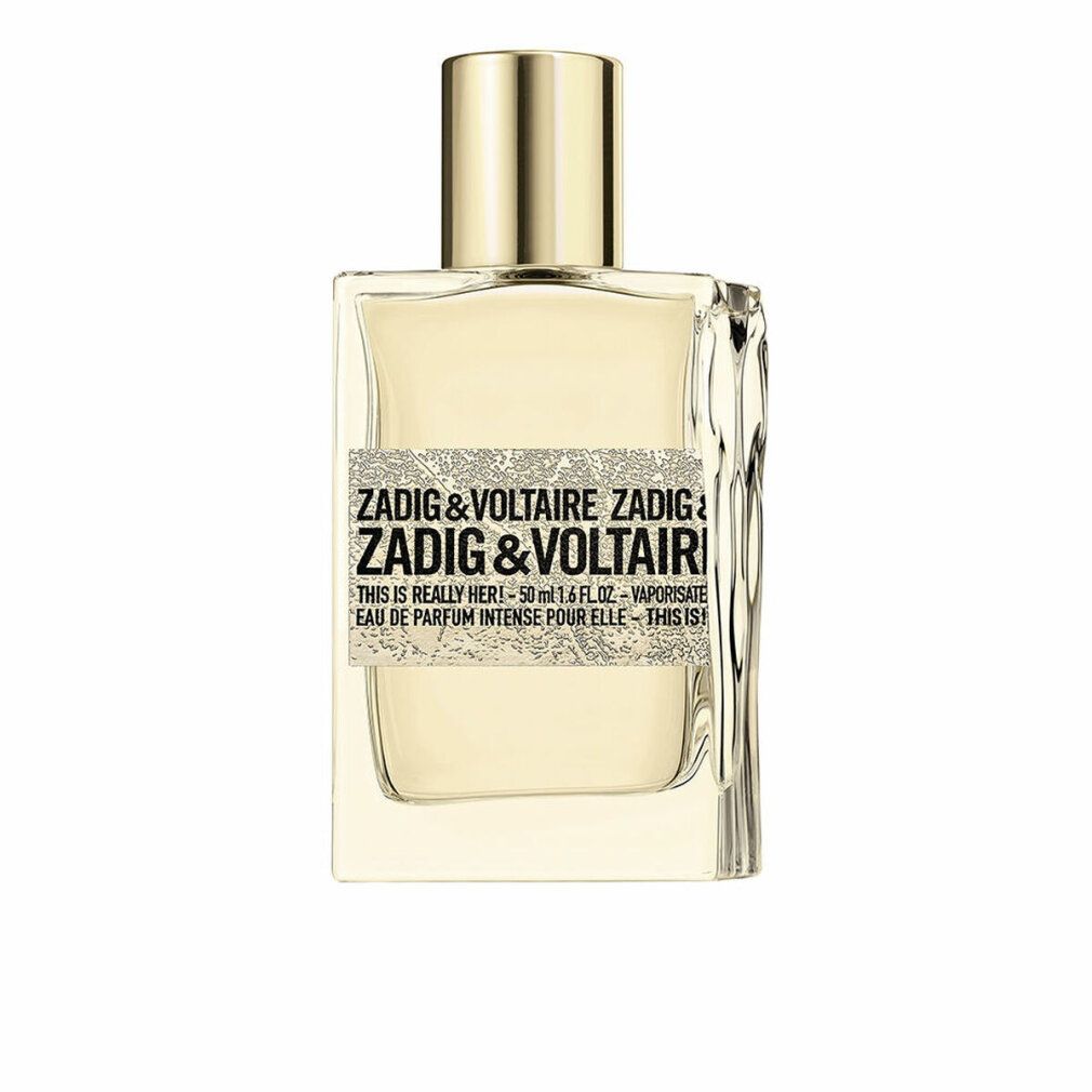 Zadig & Voltaire Duftflakon. Rechteckige Form, goldfarbener Verschluss. Aufkleber mit Produktinformationen.