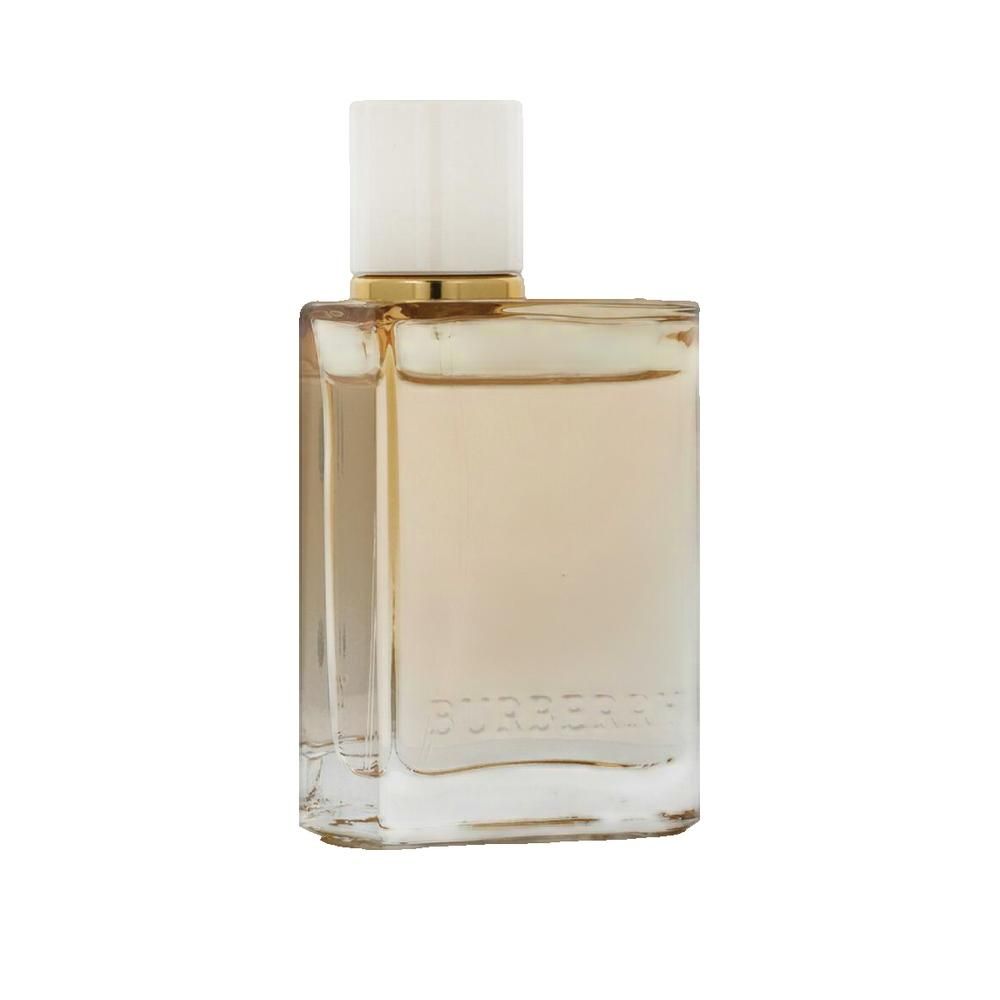 Quadratischer Glasflakon mit beigem Inhalt und hellem Deckel. Goldener Ring am Hals.