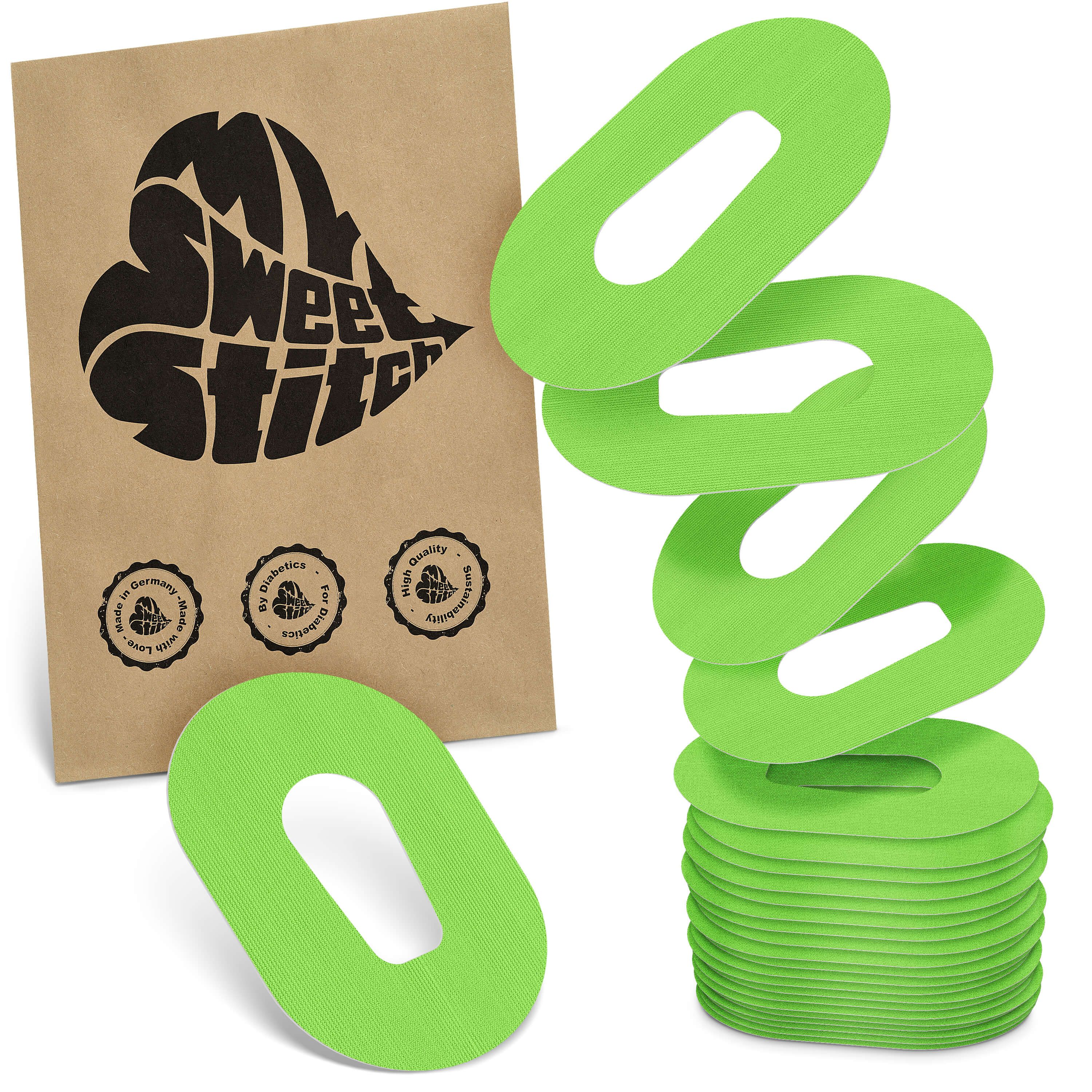 Grüne, ovale Pflaster mit Aussparung. Verpackung mit Logo 'MySweetStitch'. Siegel mit Text.