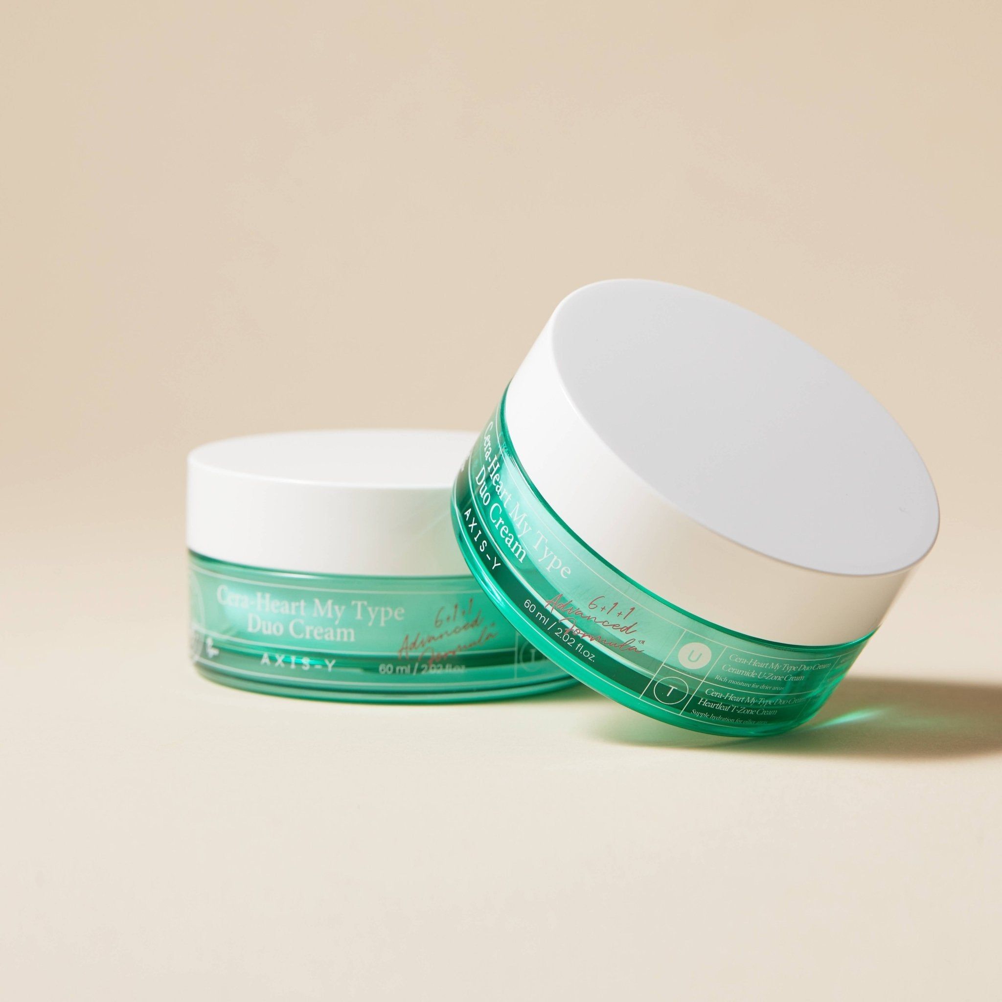Zwei grüne Creme-Dosen mit weißem Deckel. Aufschrift: Cera-Heart My Type Duo Cream. Marke: AXIS-Y. 60 ml.
