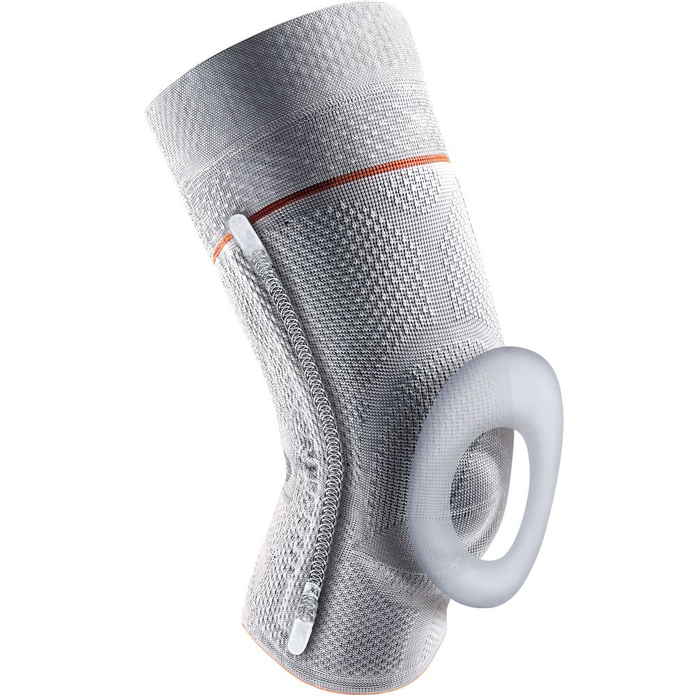 Graue Kniebandage mit seitlichem Reißverschluss, rotem Rand und ringförmiger Pelotte.