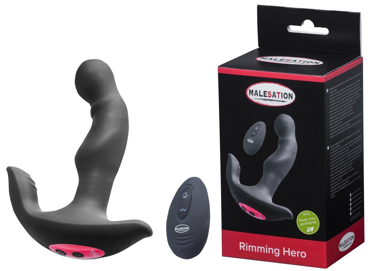 Schwarzer Rimming Hero mit Fernbedienung und Verpackung. Das Produkt ist aus Silikon und hat eine gebogene Form.