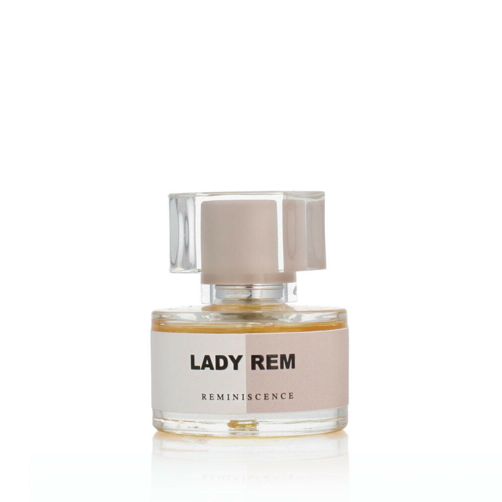 Glasflakon von Lady Rem Eau de Parfum. Aufschrift: Lady Rem, Reminiscence. Transparenter Verschluss.