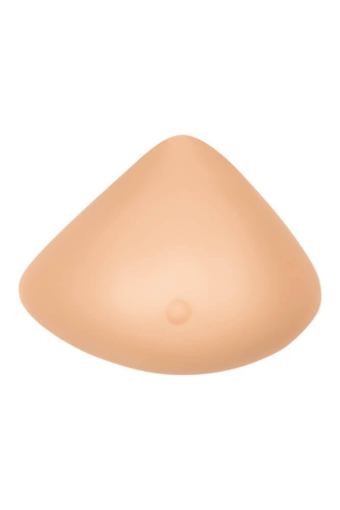 Brustprothese in mittlerer Brustform. Hautfarbenes Silikon, tropfenförmig. Kleine Erhebung in der Mitte.