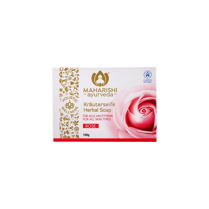 Seife mit Rose. Rechteckige Verpackung mit Logo, Text und Rosenblüten-Abbildung. Aufschrift: Kräuterseife, für alle Hauttypen.