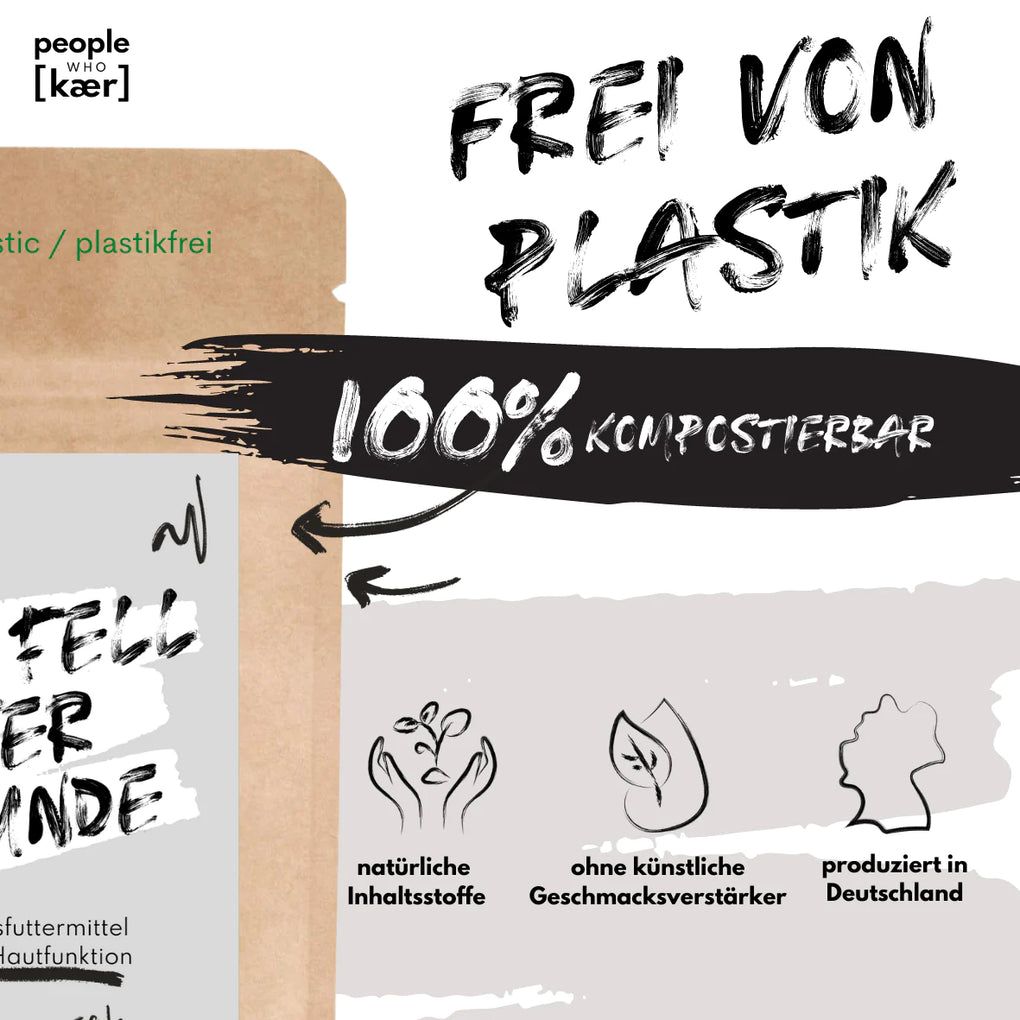Produktverpackung mit Text 'Haut & Fell Pulver für Hunde'. Text: 'Frei von Plastik', '100% kompostierbar'. Symbole für natürliche Inhaltsstoffe, ohne künstliche Geschmacksverstärker.