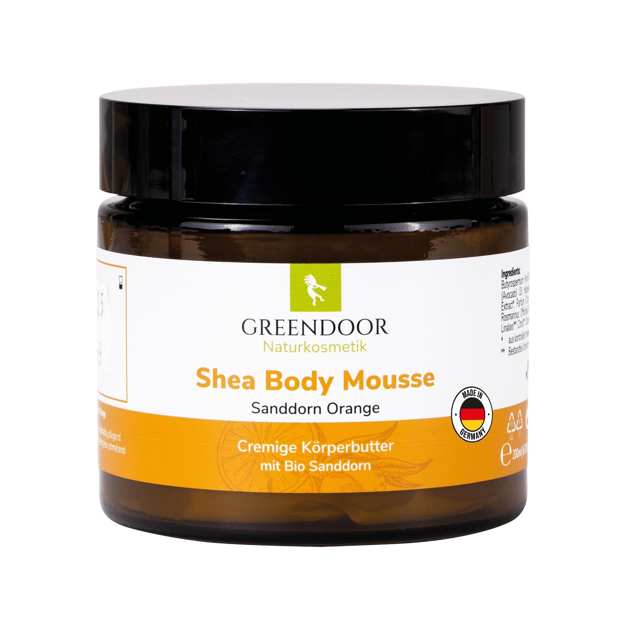 GREENDOOR Shea Body Mousse Sanddorn Orange in einem Braunglastiegel mit schwarzem Deckel.