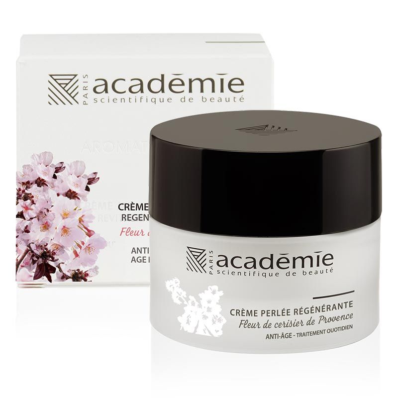 Creme-Tiegel und Schachtel. Aufschrift: Académie, Crème Perlée Régénérante, Anti-Age. Abbildung von Blüten.