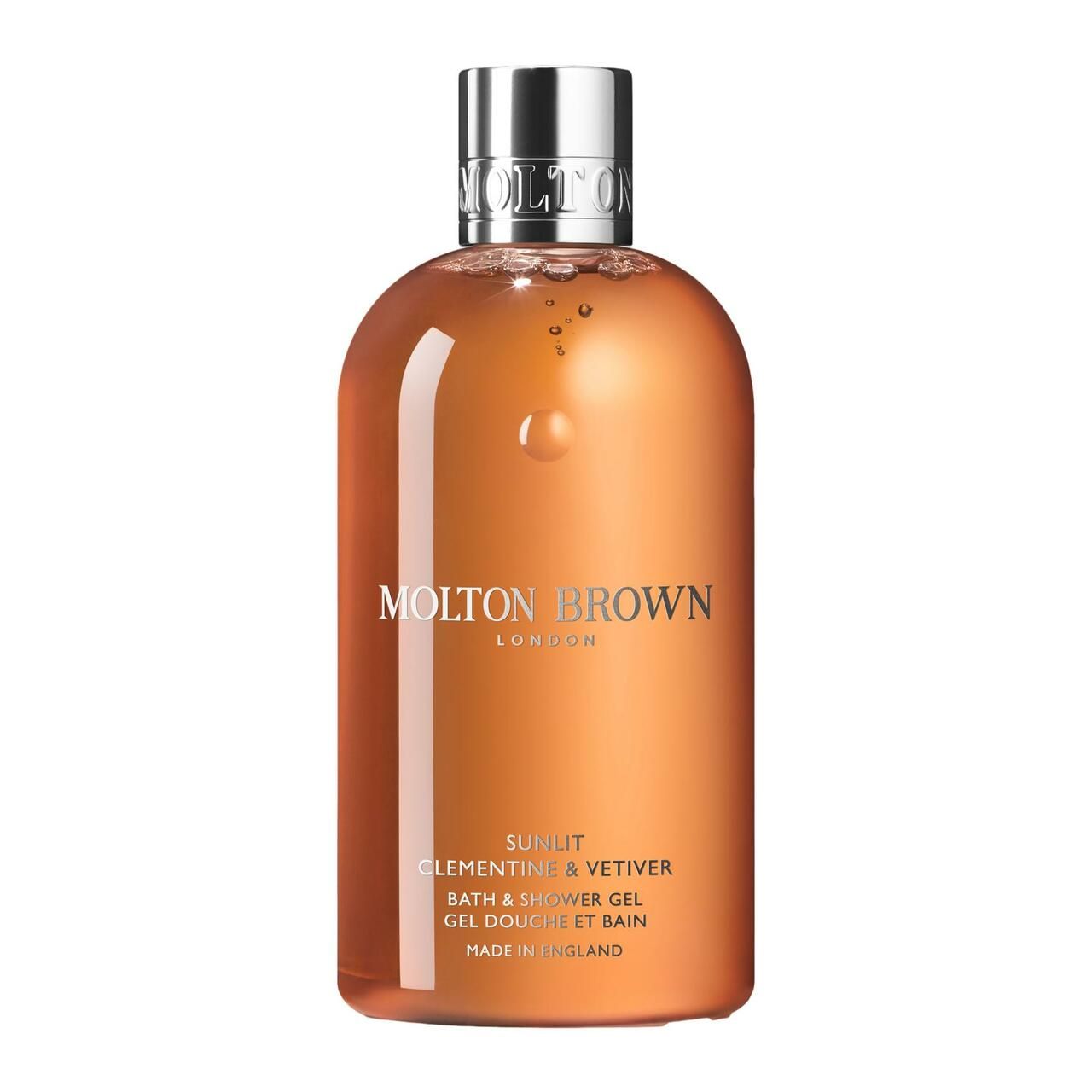 Orangefarbenes Duschgel in einer Flasche mit silbernem Deckel. Aufschrift: Molton Brown, Sunlit Clementine & Vetiver, Bath & Shower Gel.