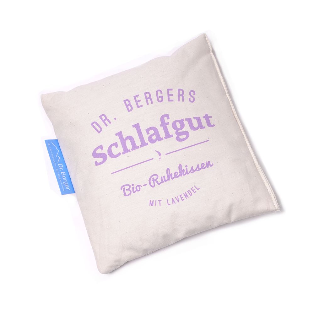Beige Kissen mit lila Schriftzug "Schlaf gut" und Etikett "Dr. Berger".