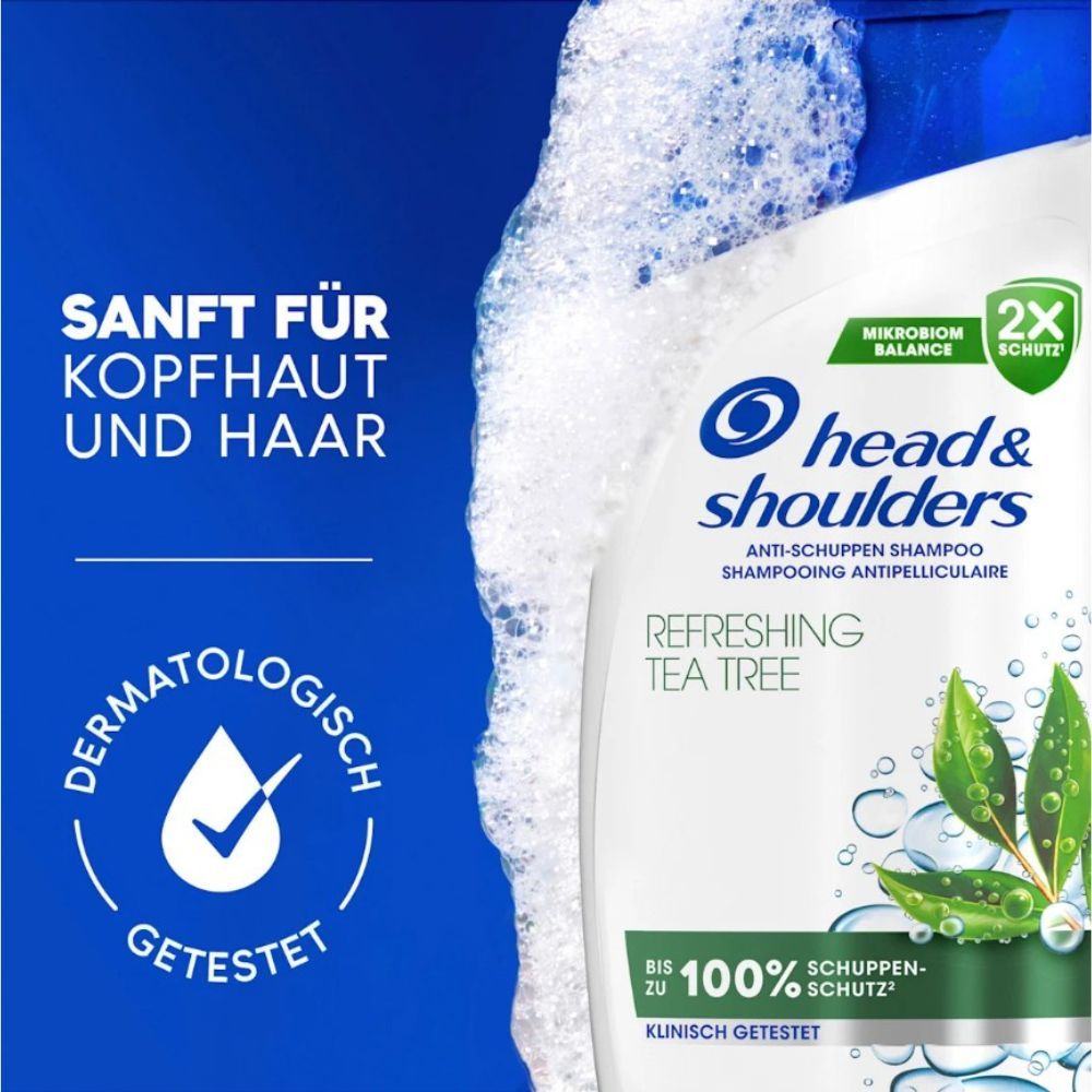 Gros plan sur un flacon de shampooing Head & Shoulders. Sceau testé dermatologiquement. Mousse.