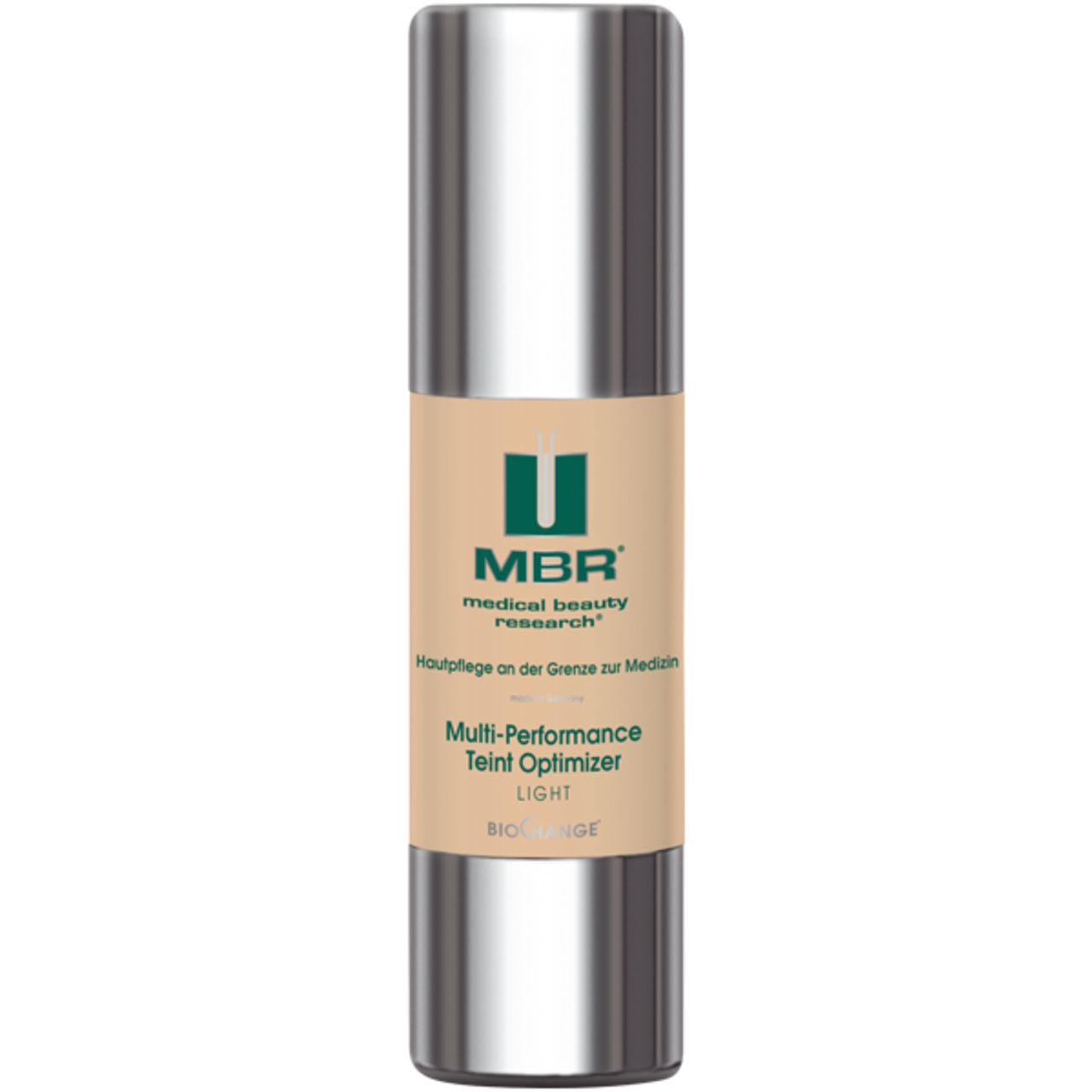 Zylindrische Flasche mit silberner Kappe. Auf dem Etikett: MBR, Multi-Performance Teint Optimizer, LIGHT. Beige-farbenes Produkt.