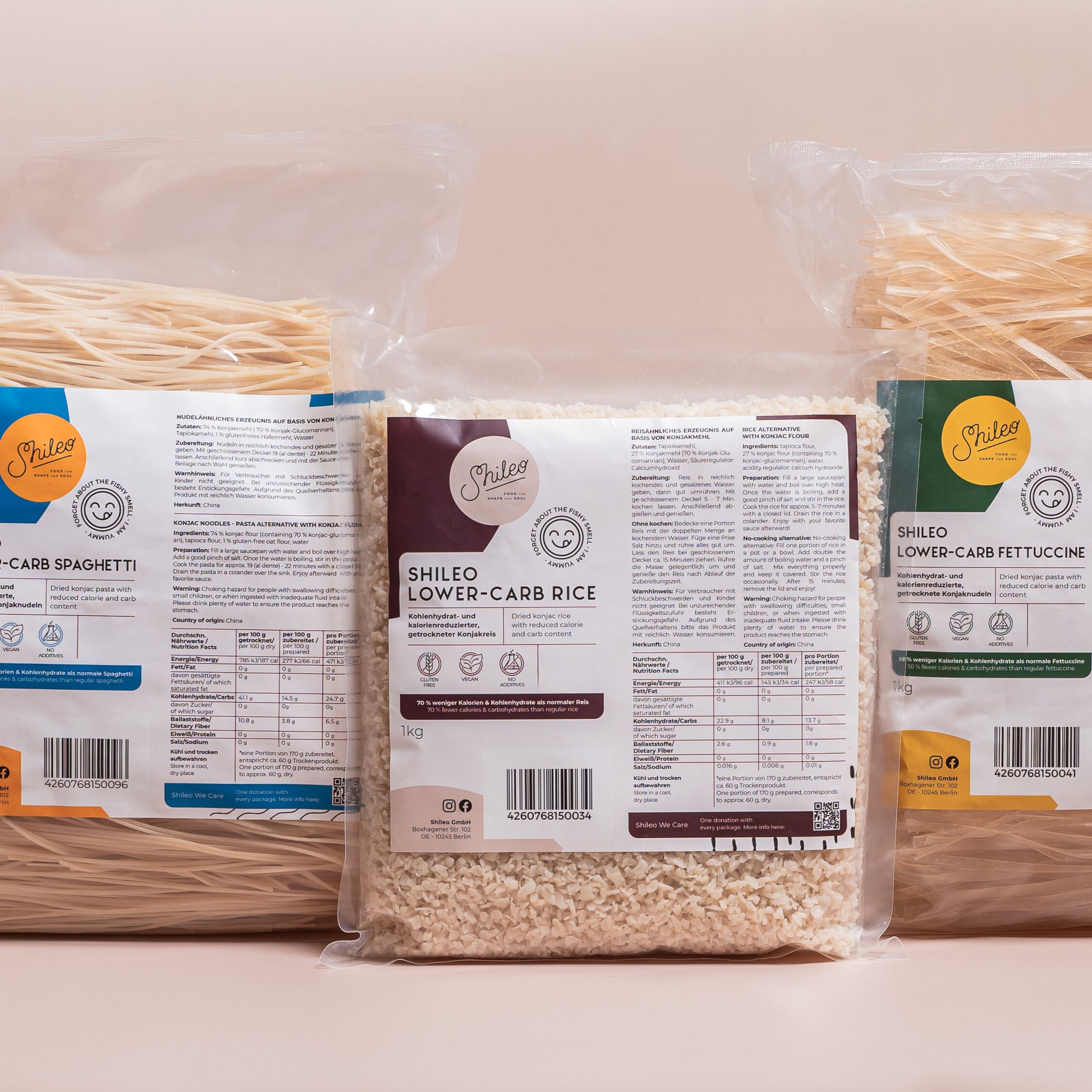 Drei Packungen SHILEO-Nudeln und Reis. Fettuccine, Reis und Spaghetti in transparenten Beuteln. Produktnamen und Logos sichtbar.