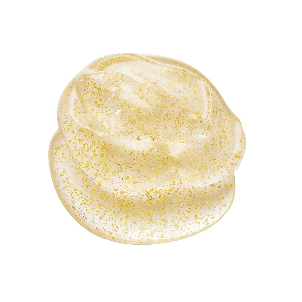 Geleartige Creme mit goldenen Partikeln. Nahaufnahme.