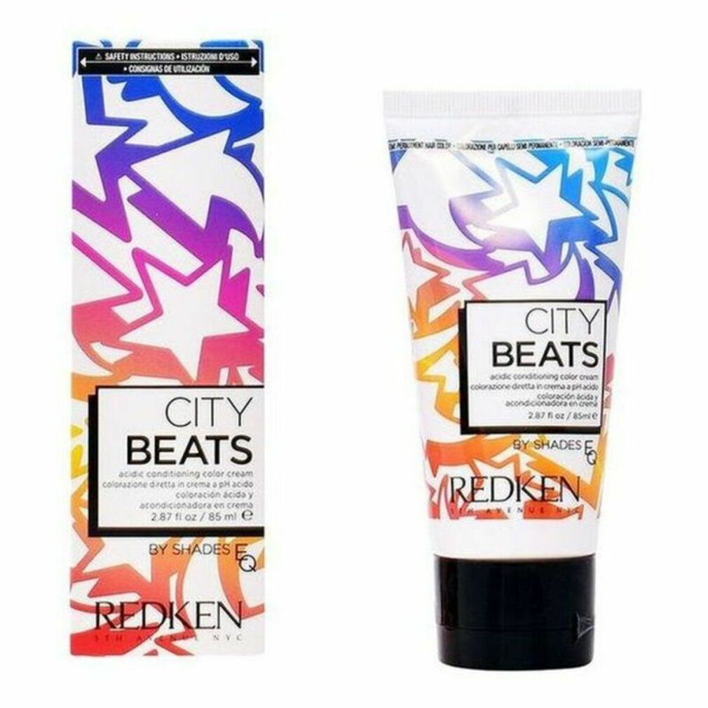 Farbcreme-Tube und Schachtel. Aufdruck: CITY BEATS, REDKEN. Farbverlauf-Design mit Sternen. Schwarzer Tubenverschluss.
