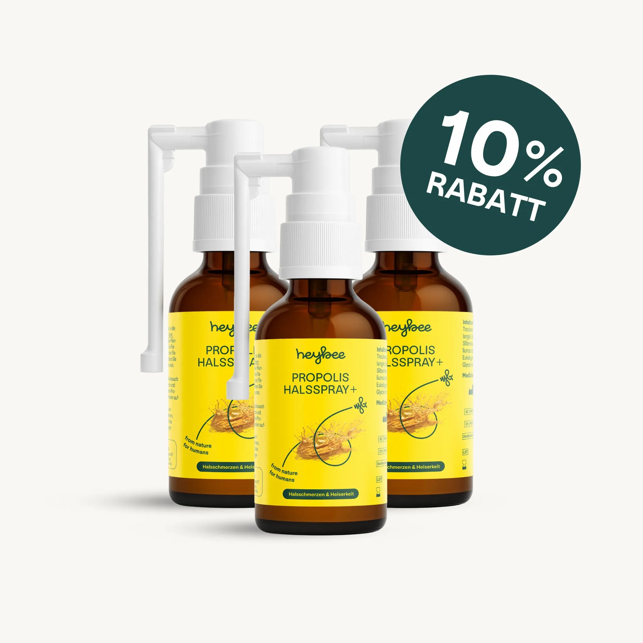 Drei Heybee Propolis Halsspray+ Flaschen. 10% Rabatt-Siegel. Braune Flaschen mit weißem Sprühkopf.
