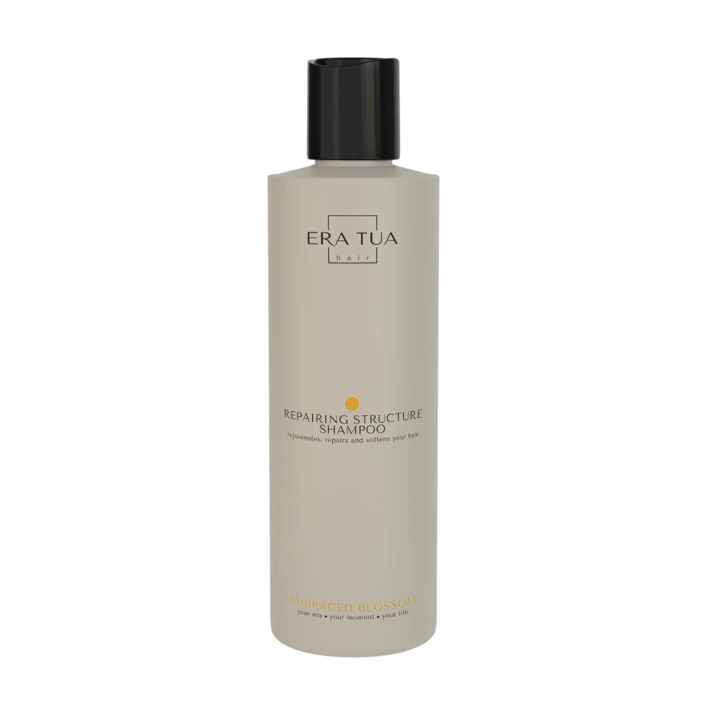 Beige Flasche mit schwarzem Deckel. Aufschrift: Era Tua, Repairing Structure Shampoo. Gelber Punkt. Text: Für ein gesundes und schönes Haar.