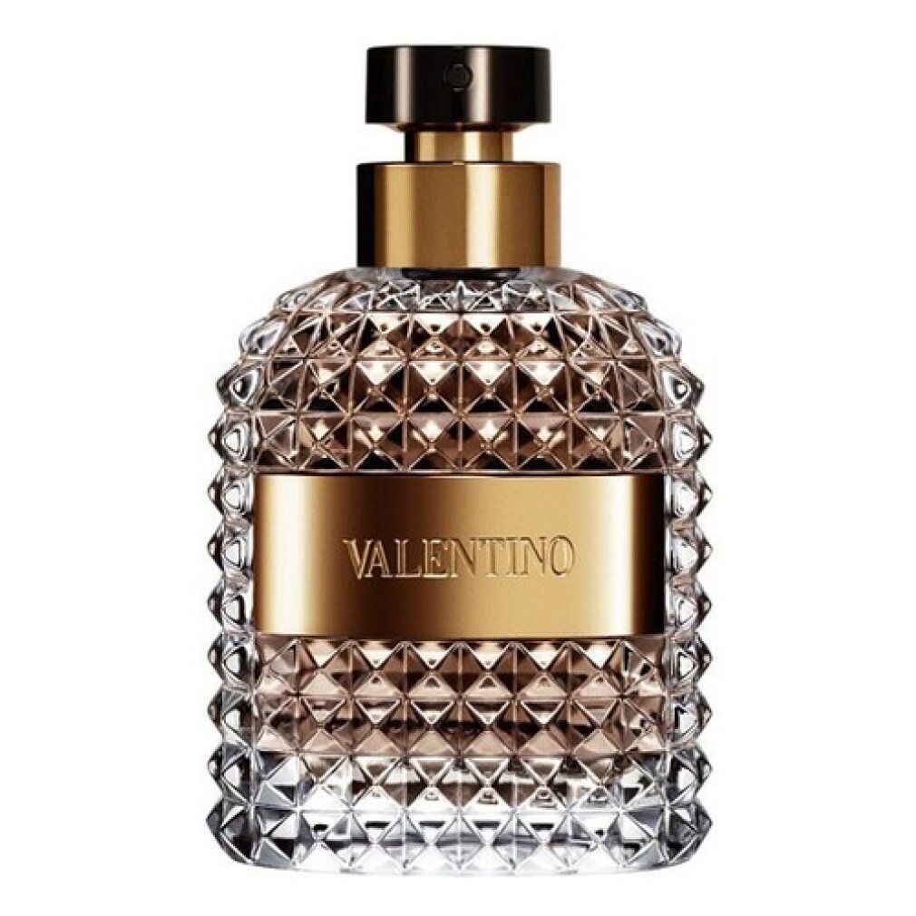 Valentino Uomo Edt Spray Flakon. Pyramidenförmiges Design, goldfarbene Band und schwarzer Deckel. Klarer Glasflakon.