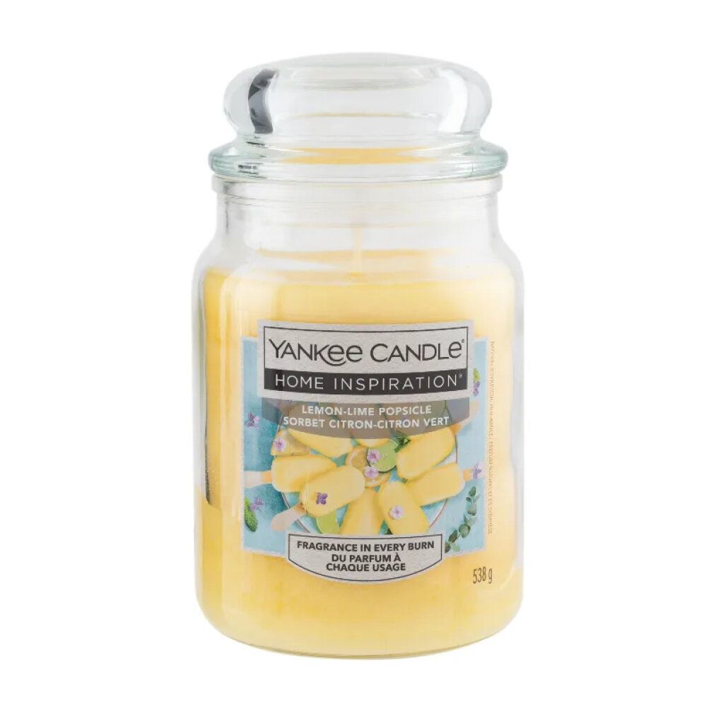 Duftkerze im Glas mit Deckel. Aufkleber mit Produktname und Abbildung von Eis am Stiel. Marke: Yankee Candle Home Inspiration.
