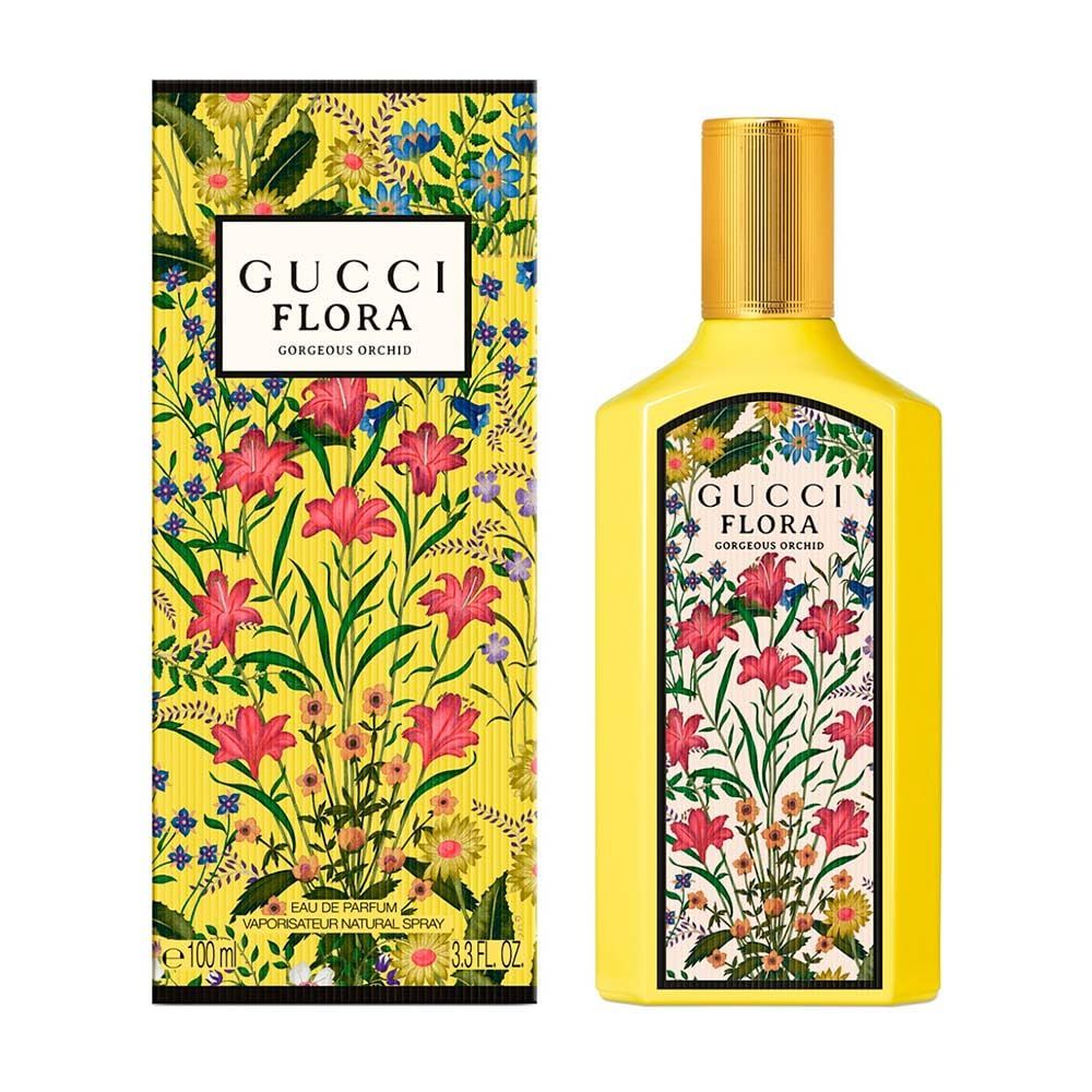 Gelbe Flasche und Verpackung mit floralem Muster. Aufschrift: Gucci Flora Gorgeous Orchid.
