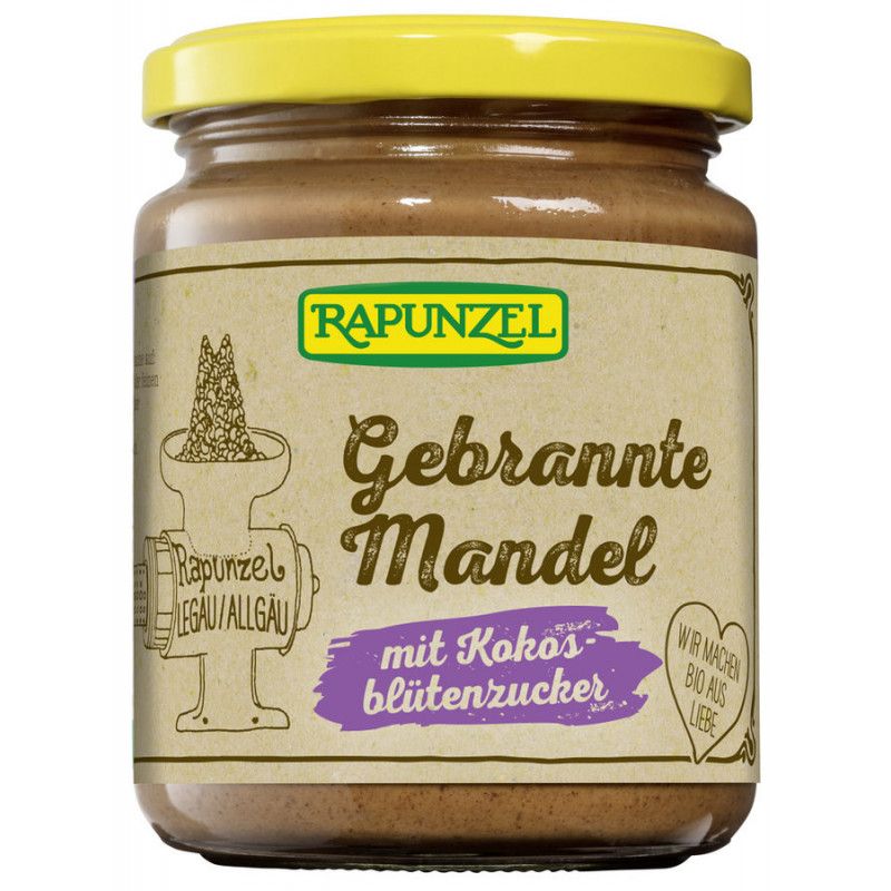 Glas mit Aufstrich. Etikett mit "Rapunzel", "Gebrannte Mandel mit Kokosblütenzucker". Gelber Deckel.