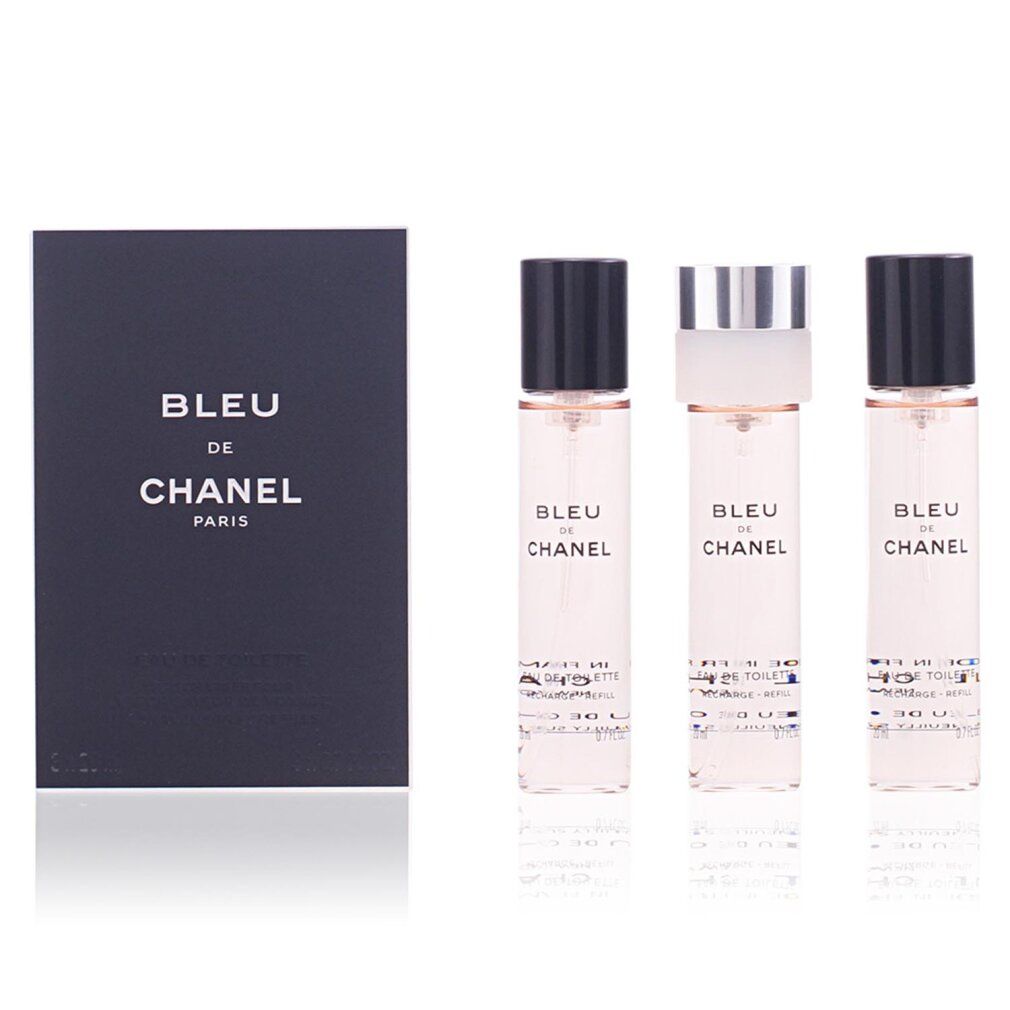 Drei kleine Parfümflakons und eine schwarze Box von Bleu de Chanel Paris.