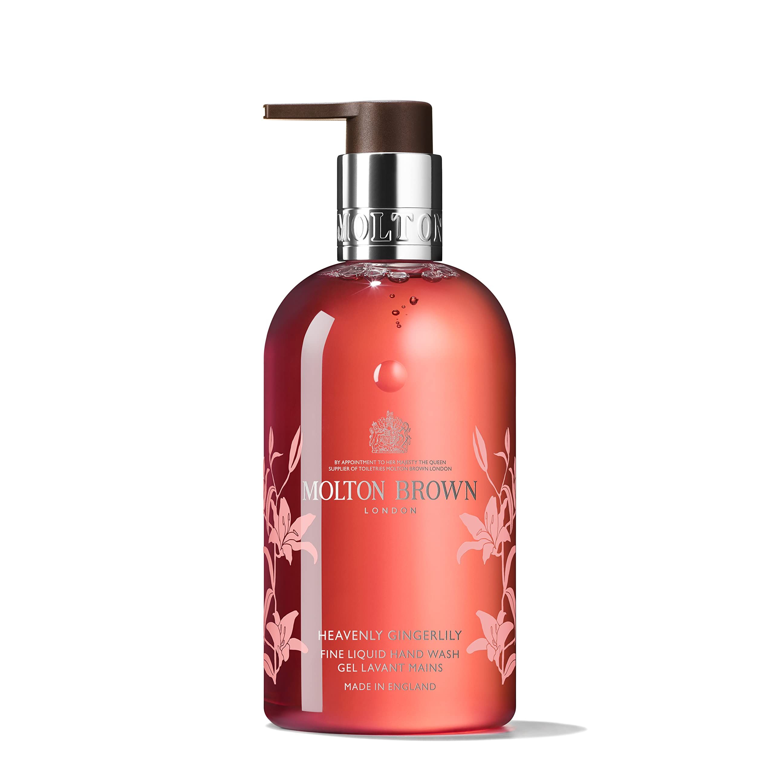Rote Flüssigseife mit Pumpe. Aufschrift: Molton Brown, Heavenly Gingerlily. Floral-Dekor.