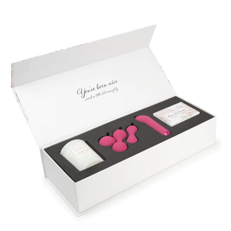 Geöffnete Geschenkbox mit Kerze, Kegel-Übungsbällen, Vibrator und Karten.