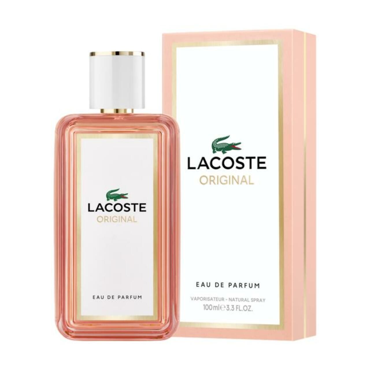 LACOSTE Original Femme EdP Nat. Spray Flakon und Verpackung. Rosa Karton mit weißem Etikett und goldenen Akzenten.