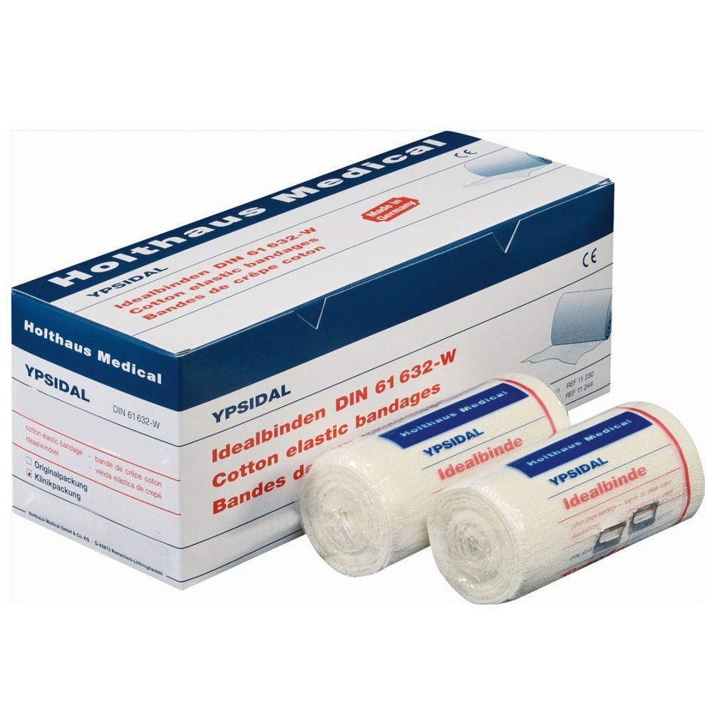 Verpackung von YPSIDAL Idealbinden. Zwei Rollen daneben. Aufschrift: Holthaus Medical, DIN 61 632-W.