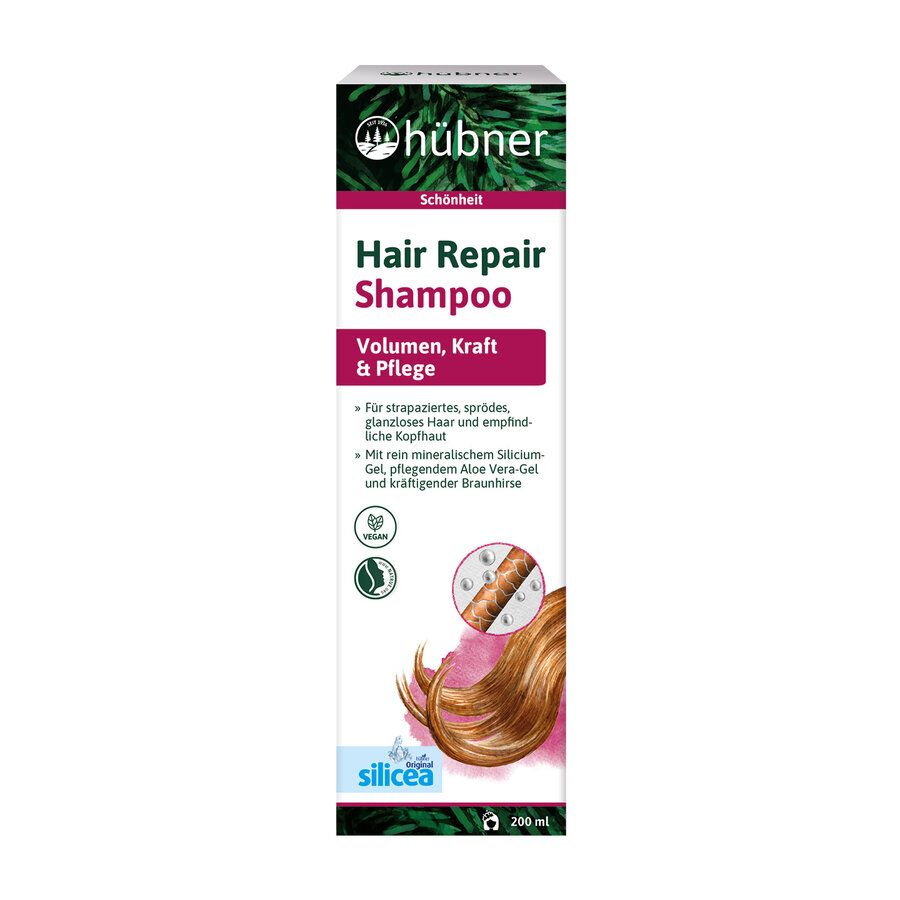 Hübner Hair Repair Shampoo. Verpackung mit Produktnamen, Logo und Inhaltsangaben. Enthält Volumen, Kraft & Pflege. Vegan-Siegel.