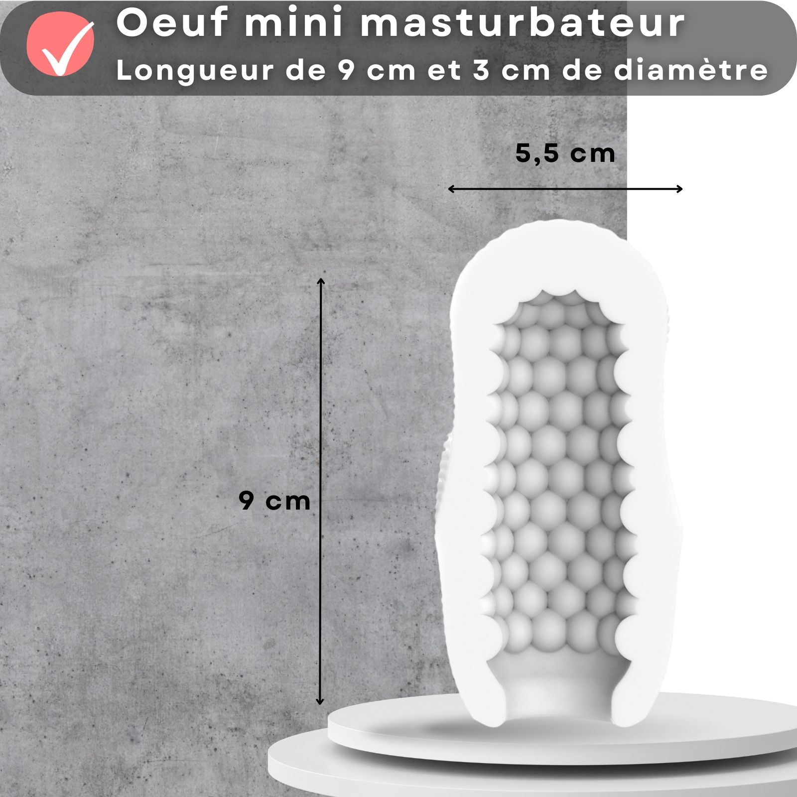 Œuf masturbateur blanc avec picots. Dimensions: 9 cm de long, 5,5 cm de large. Texte: Mini œuf masturbateur. Longueur de 9cm et 3cm de diamètre.