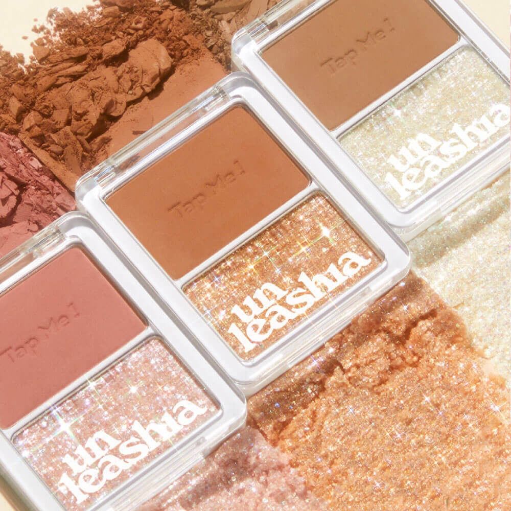 Drei UNLEASHIA Tap Me Palette Duo-Produkte. Jedes Produkt hat zwei Bereiche: einen matten und einen glitzernden.