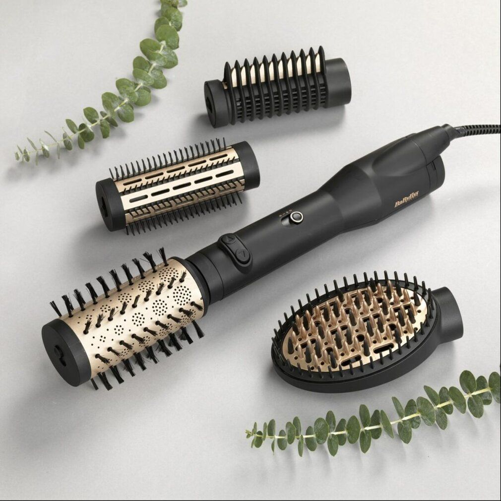 Schwarzer Lockenstab mit drei Aufsätzen. Goldfarbene Bürstenköpfe. BaByliss Logo.