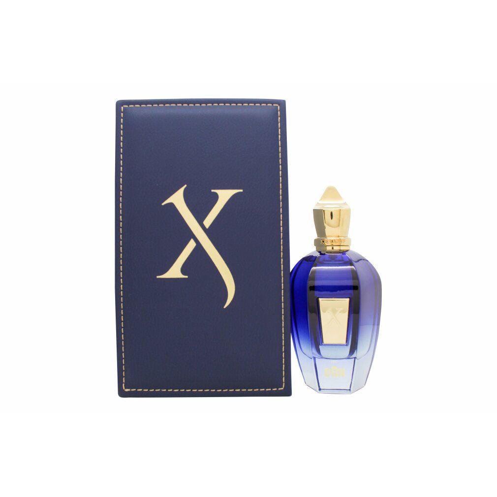 Blau-goldene Flasche und Box. Box mit goldfarbenem 'X' Logo. Flasche mit goldfarbenem Verschluss.