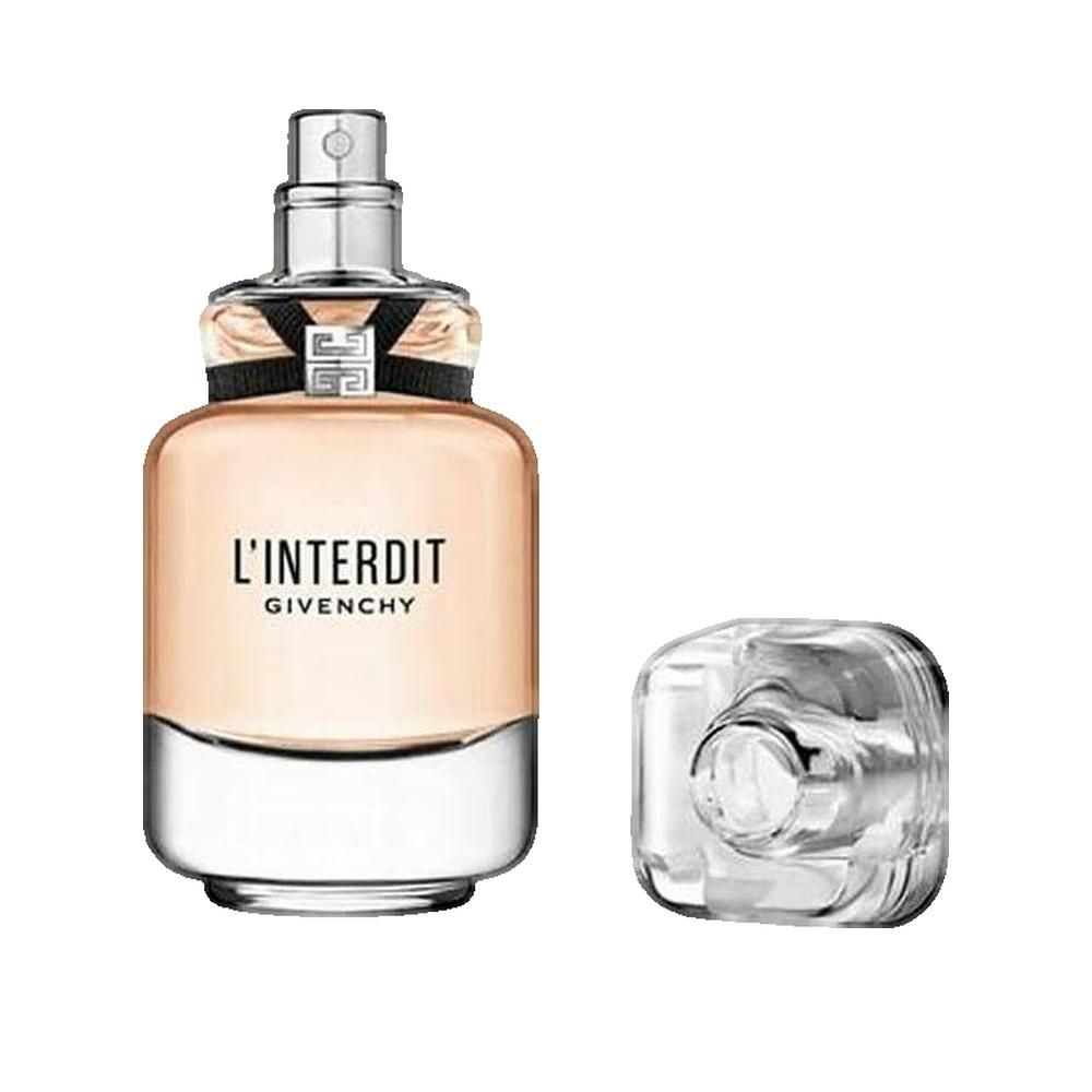 Parfümflasche mit Zerstäuber und separater Kappe. Aufschrift "L'Interdit Givenchy". Flasche aus Glas, Kappe transparent.