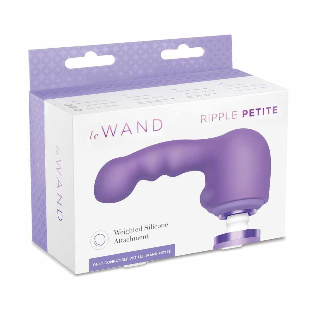 Verpackung mit lila Aufsatz. Aufsatz mit Griff und abgerundeter Spitze. Text: le Wand, Ripple Petite.