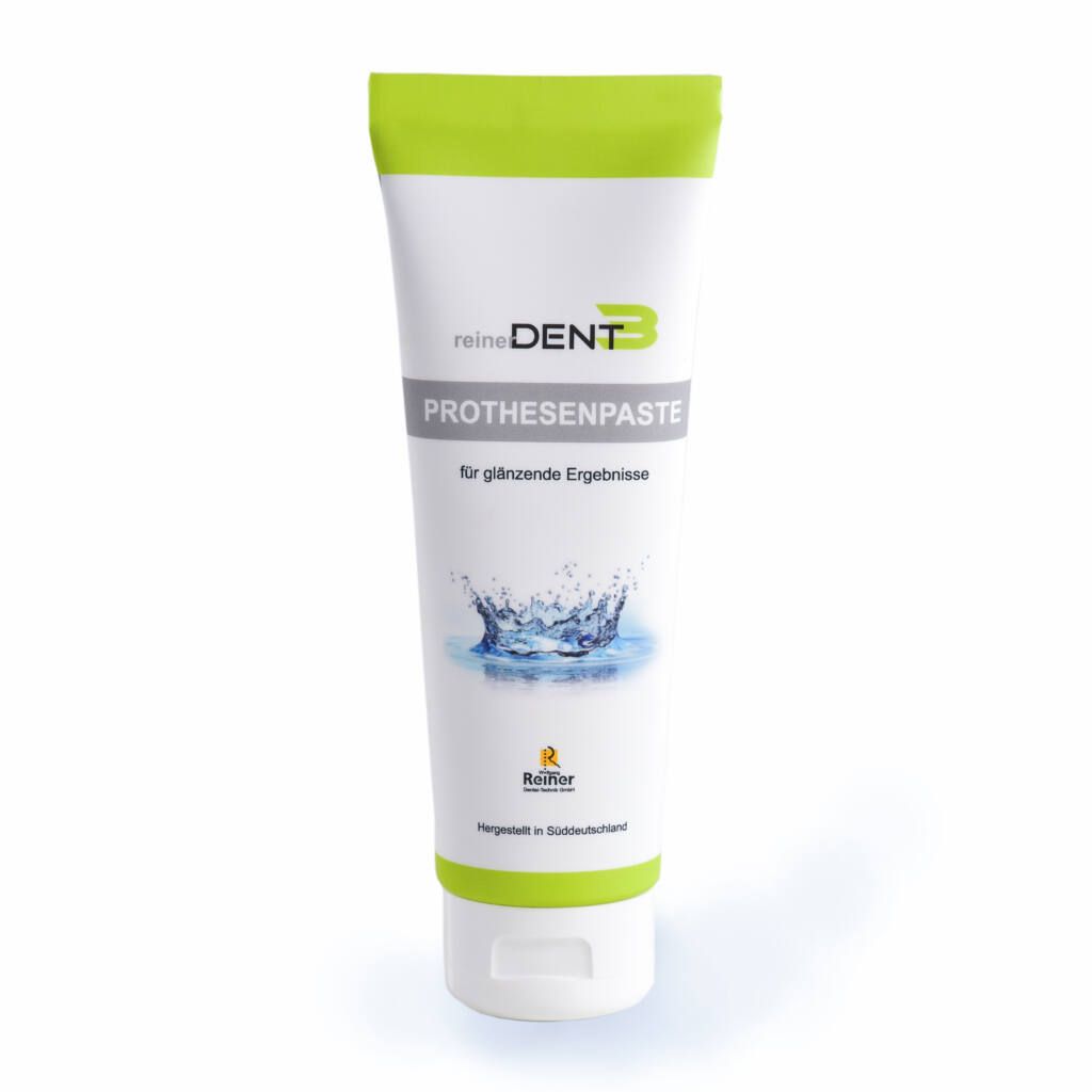 Zahnprothesenpaste in Tube. Weiß-grüne Tube mit Produktnamen und Wasser-Grafik. Herstellerlogo unten.
