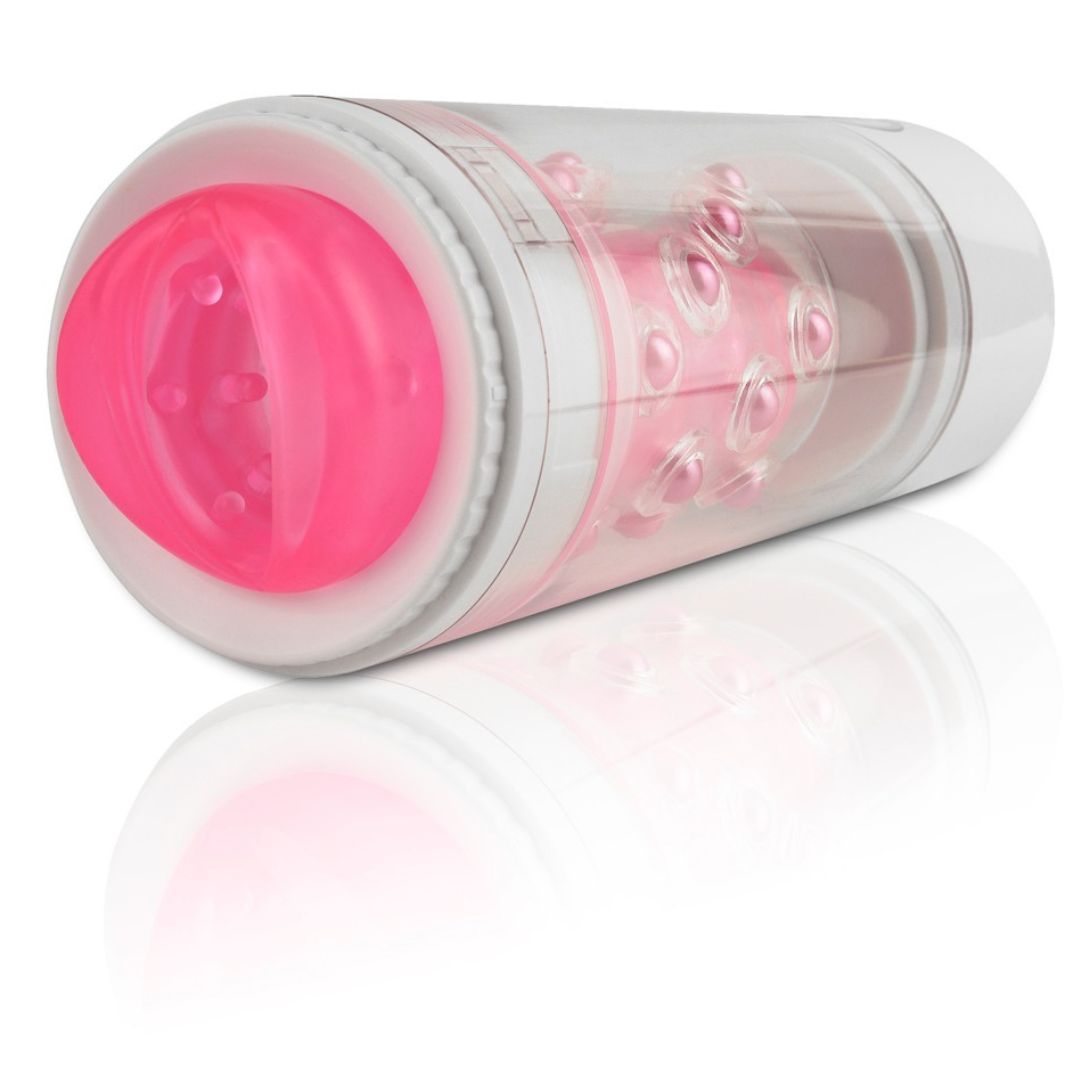 Zylindrisches Gerät mit rosa Innenleben und weißen Elementen. Sichtbare Noppen und Öffnungen.